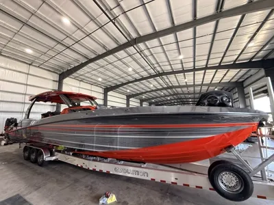 Red and grey performance boat on its trailer, polished